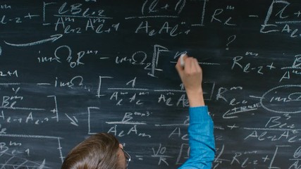 Wall Mural - Student Writing Mathematical Formula/ Equation on the Blackboard. 