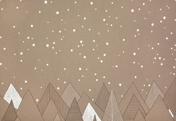 hand made illustration of snow falling over a forest, on natural, brown paper