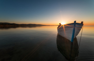 Lonely boat at sunset