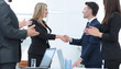 © ASDF - handshake business partners after discussion of the contract