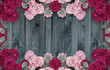 Card with roses and place for your text on background of shabby wooden planks in rustic style