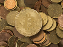 Golden Bitcoin Coin On A Background Of Euro Coins