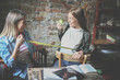 © Mladen - Two young girls having funny conversation. Girl measure to his friend waist.