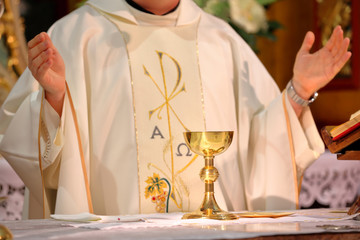 Wall Mural - Priest celebrate mass at the church