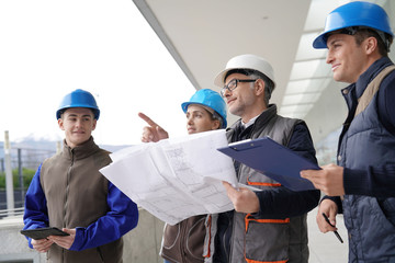 Wall Mural - Instructor with young people in engineering training