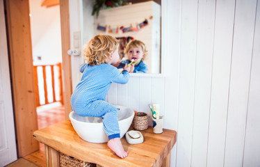 toddler boy in a dangerous situation in the bathroom.