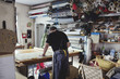 © Maskot - Man working in textile workshop