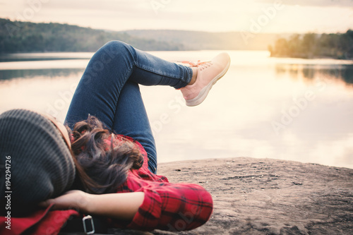 Fotomural Relaxing moment Asian tourist sleeping on rock waiting for sunset ,enjoying time