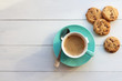 © Helga P-A. - Coffee in a turquoise mug and cookies on a white table the top view