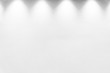 © jayzynism - Empty white wall with halogen with lamps.