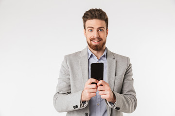 Wall Mural - Portrait of an excited young man dressed in shirt