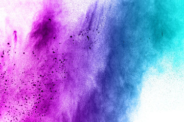 Wall Mural - abstract explosion of blue purple dust on white background.Abstract blue purple powder splatter on white  background. Freeze motion of blue purple powder splash.