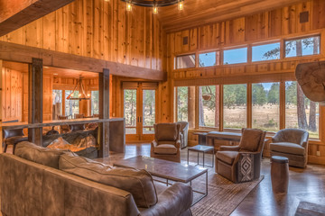 Country living room with wall of windows