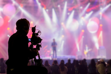Wall Mural - The filmmaker is recording and broadcasting live concerts on camcorders. Professional Video Recording Business