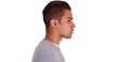 © Mark Adams - Side view of Hispanic man with cool undercut standing with white background. Profile close up portrait of Latino millennial