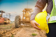 © Kwangmoozaa - Asian business man construction engineer worker with yellow protective helmet at construction site