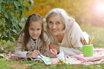 Poster - girl with her grandmother drawing  