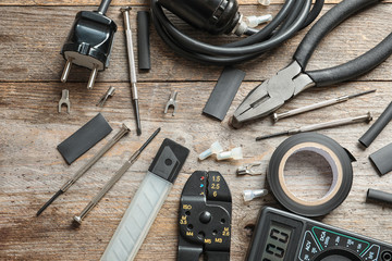 Wall Mural - Different electrical tools on wooden background