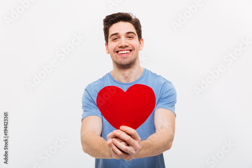 Fotografia Image of Happy man in t-shirt giving paper heart