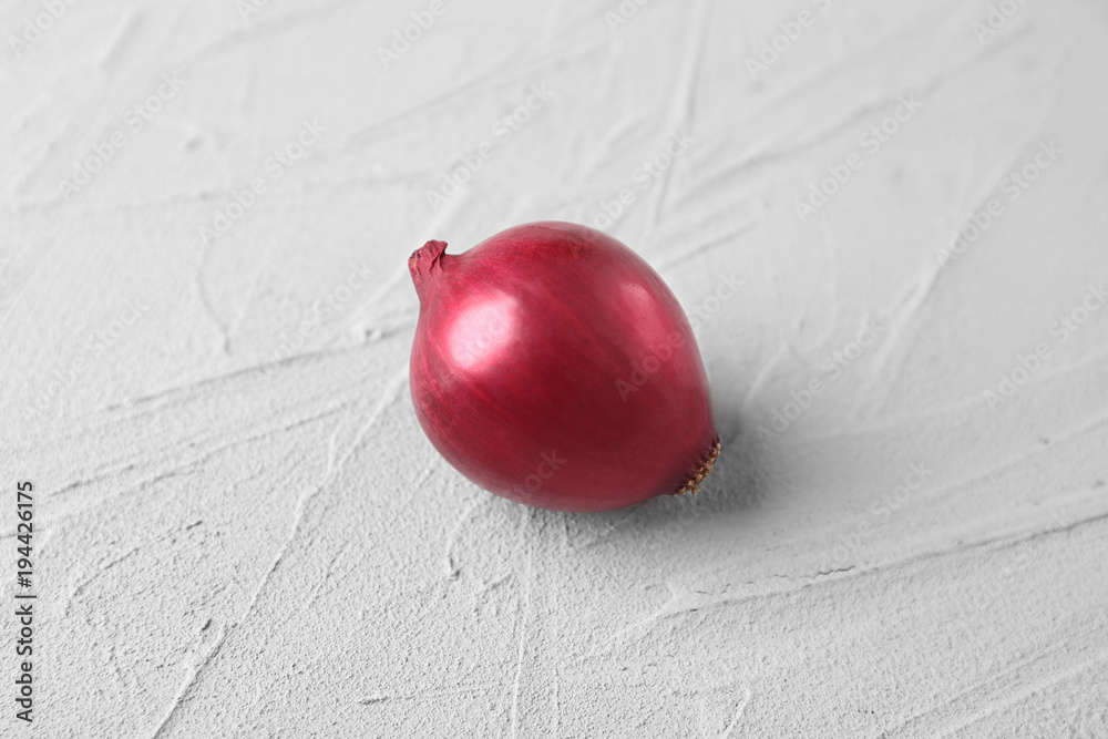 Red onion on light background