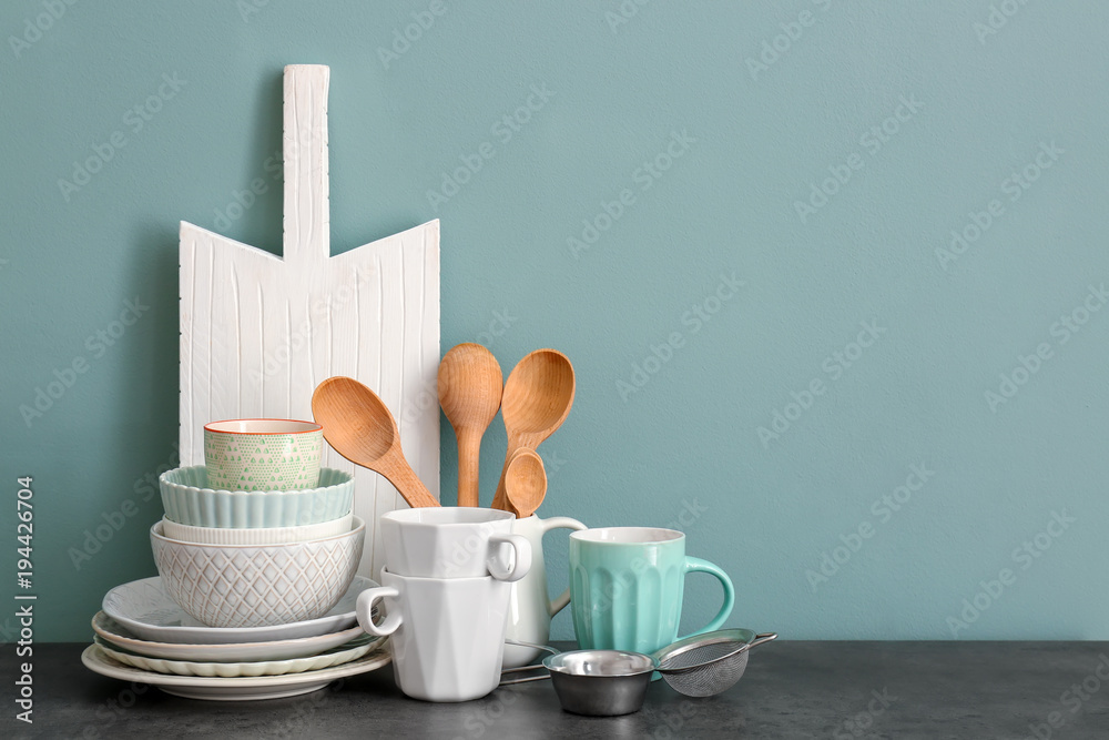 Set of cooking utensils and dishware on table