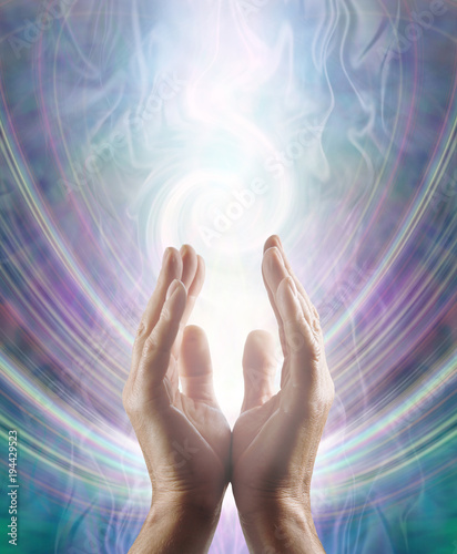 Fotografie, Obraz Sensing Spiralling Healing Energy - male  hands reaching up and sensing an ether