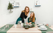 © EdNurg - Happy women couple at the festive table