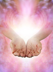 Canvas Print - sharing abundance healing energy with you - female open cupped hands with vibrant white light and ge