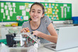 © highwaystarz - Portrait Of Female Pupil Studying Robotics In Science Lesson