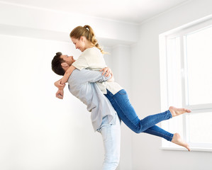 Wall Mural - happy couple at empty room of new home