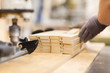 © Syda Productions - close up of carpenter hand with boards at factory