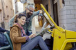 © ZoneCreative - Woman and man smiling looking at map.Side view. Caucasian couple in love roadtrip vacation italian travel on convertible car