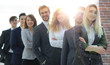 © ASDF - group of young business people standing in a row.
