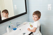 © ruslanshug - beautiful little boy with toothbrush in hand in bright bathroom