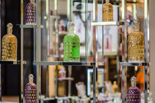 Colorful Different Perfume Bottles Displayed At Fragrance Store Shelves
