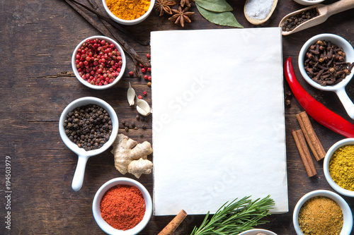 Fotomural Open recipe book with fresh herbs and spices