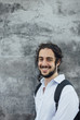© mmarko/Stocksy - Portrait of young man smiling