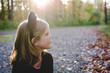 © Lindsay Crandall/Stocksy - Young girl in a cat costume on Halloween