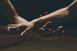 © Sonja Lekovic/Stocksy - male and female hands touching closeup