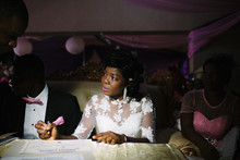 A Nigerian Bride Signs Her Marriage Certificate.