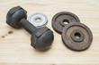 © emodpk - heavy dirty and grunge metal dumbbell for fitness workout bodybuilding on the wood background, dumbbell for exercise in sport gym