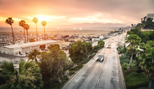 Aerial Panoramic View Of Ocean Ave Freeway In Santa Monica Beach At Sunset - City Streets Of Los Angeles And California State Surrounds - Warm Twilight Color Filter Tones With Dark Vignetting