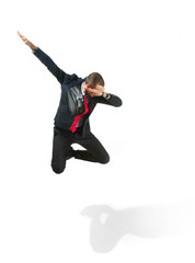 Wall Mural - Funny cheerful businessman jumping in air over white background