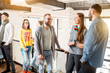 © rh2010 - Group of friends dressed casually talking together during the coffee break standing in the white conference hall