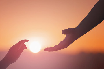 Wall Mural - helping hand outstretched for salvation on isolated toned background