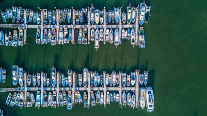 Canvas Print - Aerial view Yacht parking, A marina lot, Yacht and sailboat is moored at the quay, Aerial view by drone.
