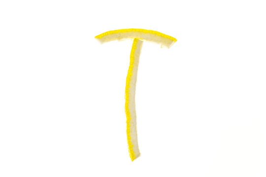 Letters of english alphabet from citron of lemon isolated on white background. T