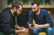 © Marko - Two friends watching media content in a smart phone