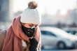 © leszekglasner - Young woman wearing protective mask in the city street, smog and air pollution