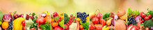 Healthy Vegetables And Fruits On Multicolored Blurred Background.